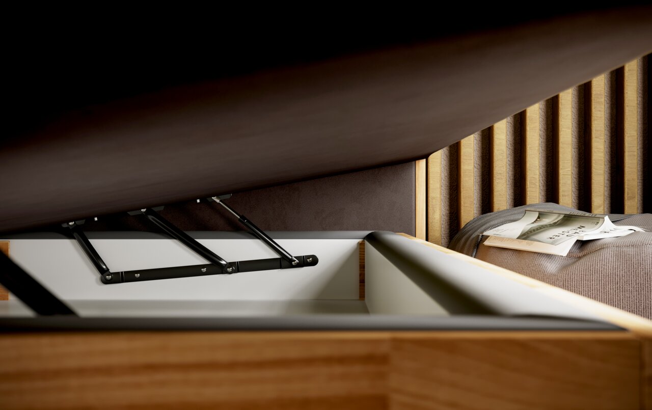 Close-up van een boxspringbed met geopende opberglade, waarop de metalen mechanismen en houten details te zien zijn.