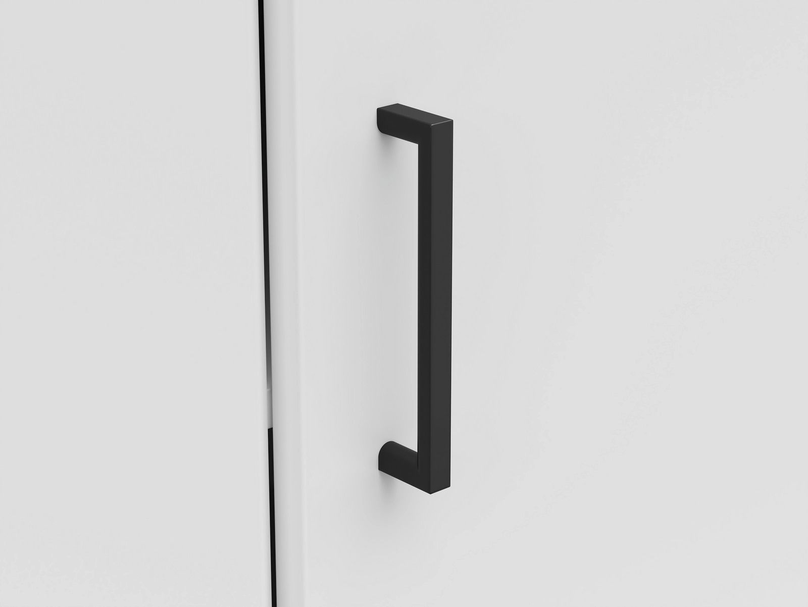 Carryhome Eckkommode MULTISTAURAUM Nahaufnahme einer schwarzen Griffstange an einer weißen Eckkommode, seitliche Perspektive.