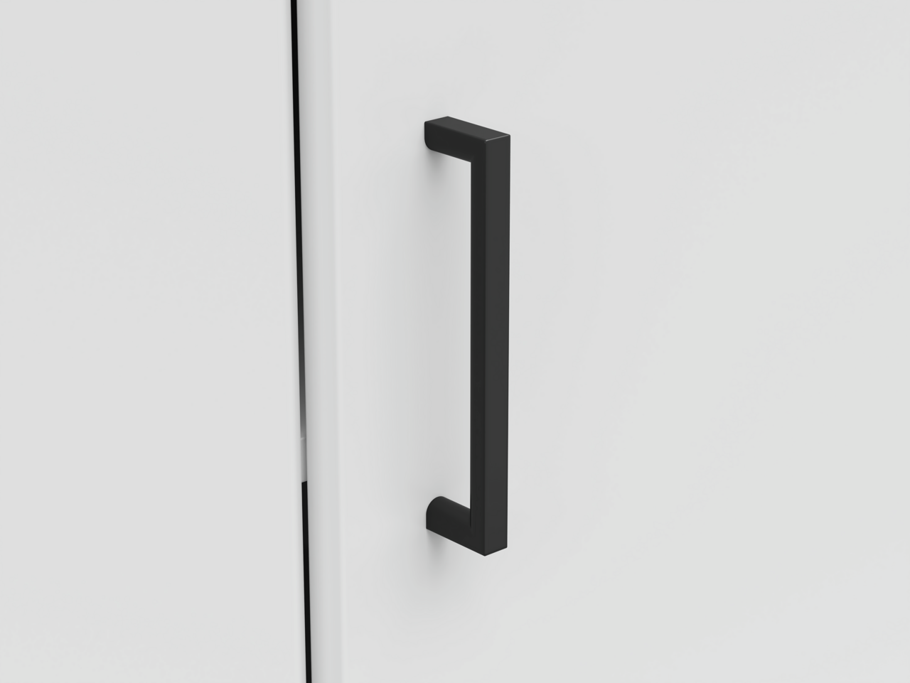 Nahaufnahme einer schwarzen Griffstange an einer weißen Eckkommode, seitliche Perspektive.