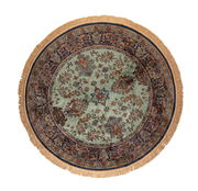 Runder Teppich mit orientalischem Muster in Grün- und Blautönen, Fransen am Rand, Draufsicht