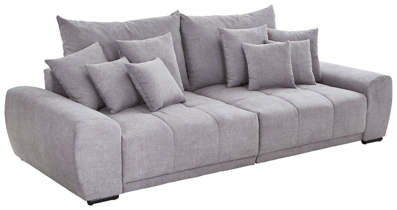 Graues Big-Sofa TAVANI mit mehreren Kissen, seitliche Perspektive