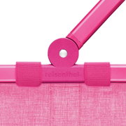 Nahaufnahme des pinken Rahmens eines Carrybag mit sichtbarem Griffgelenk, von vorne betrachtet.