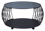 Moderner Couchtisch mit rundem Glasplatte und schwarzem Metallgestell, seitliche Perspektive.