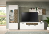 Moderne Wohnwand mit weißem Schrank, dekorativen goldenen Akzenten und integriertem TV-Bereich, seitliche Perspektive.