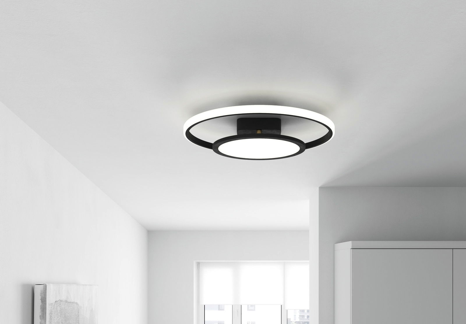 Moderne LED-Deckenleuchte Luna in einem hellen Raum, von unten betrachtet.