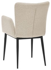 Rückansicht eines beige gepolsterten Armlehnstuhls mit schwarzen Beinen