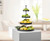 Vierstufige Etagere aus schwarzem Eisen, gefüllt mit verschiedenen Früchten, seitliche Perspektive