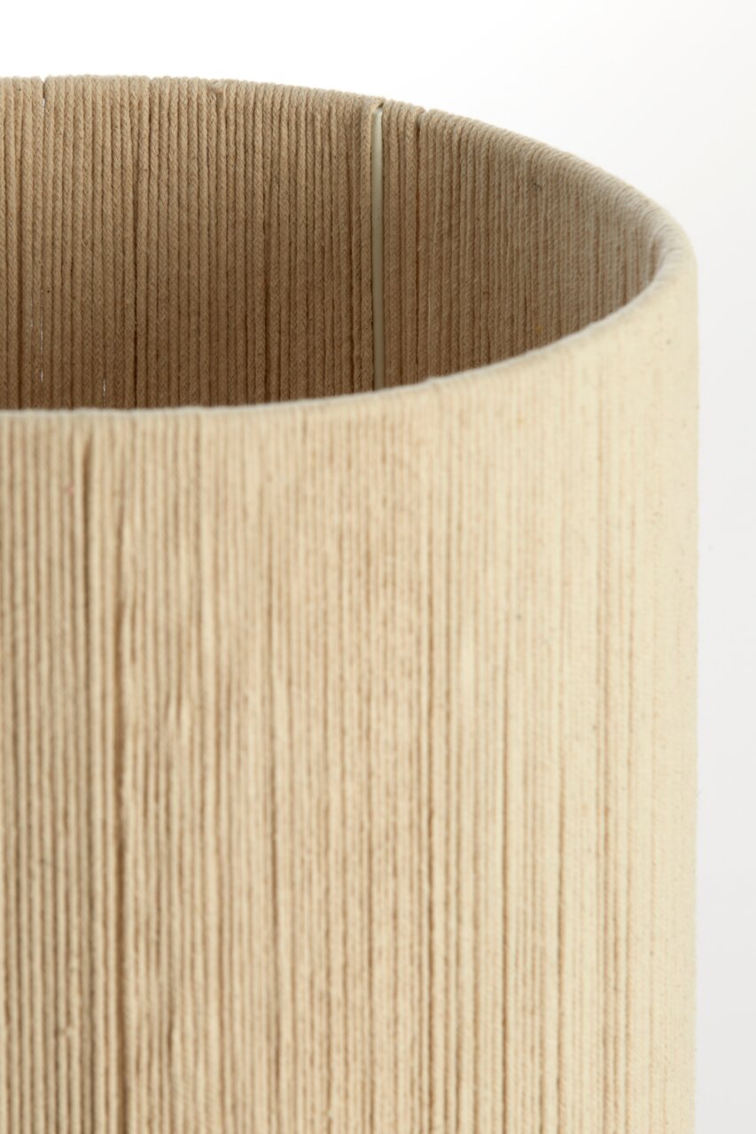 Nahaufnahme eines zylindrischen, beige-farbenen Lampenschirms mit texturierter Oberfläche, von oben betrachtet.