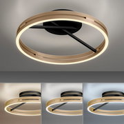 Moderne Deckenleuchte PURE Loop in goldener Ringform mit schwarzem Sockel, von unten betrachtet.