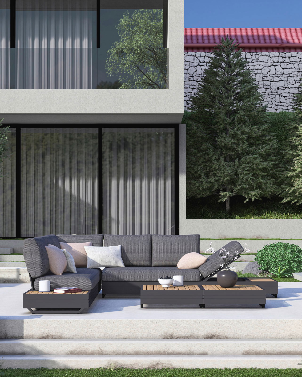 Moderne Gartenmöbel-Lounge mit grauem Ecksofa und Couchtischen auf einer Terrasse, frontal betrachtet.