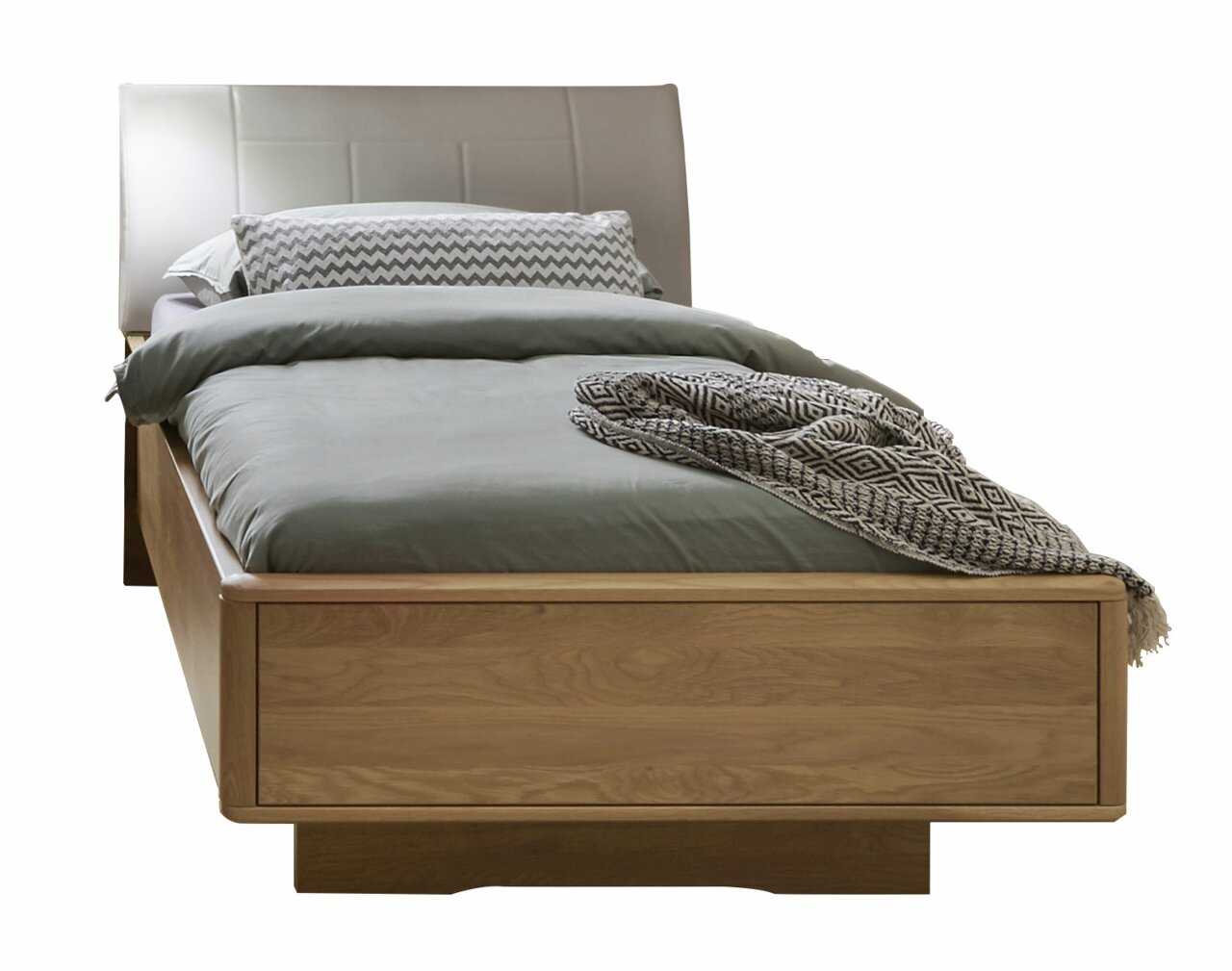 Komfortbett aus Holz mit gepolstertem Kopfteil, frontal fotografiert