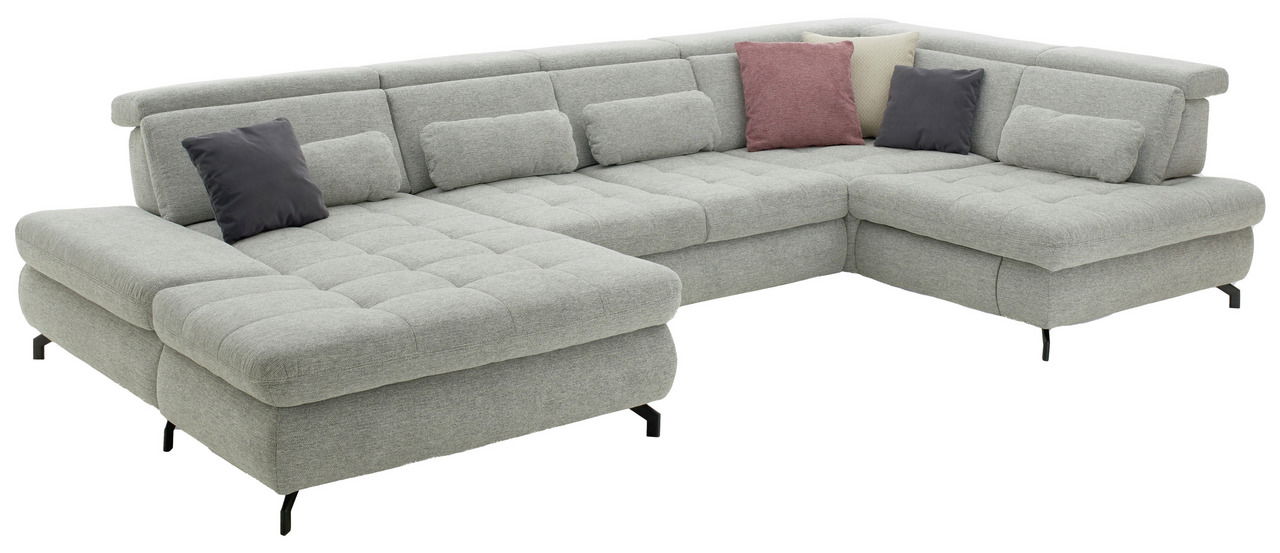 Graue Polsterrundecke mit mehreren Kissen, aus einer leicht erhöhten Perspektive fotografiert.