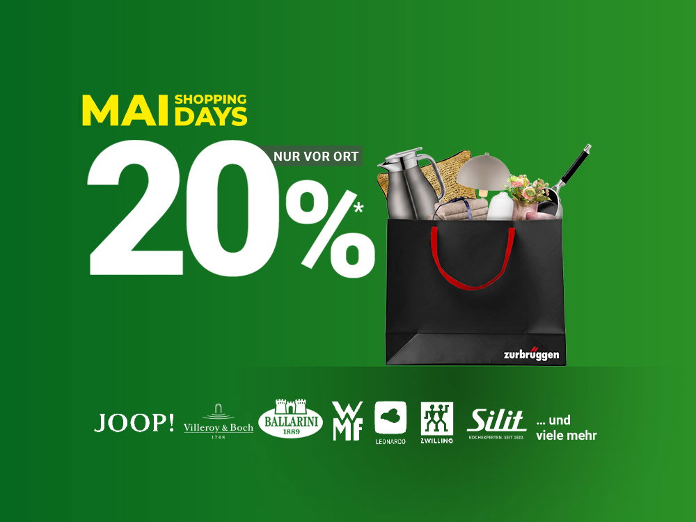 Einkaufstasche mit Wohn- und Küchenaccessoires vor grünem Hintergrund und „MAI SHOPPING DAYS“-Schriftzug