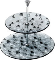 Zweistöckige Glas-Etagere mit schwarz-weißem Weihnachtsbaum-Dekor und silberfarbenem Metallgriff, in schräger Vorderansicht von oben