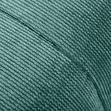 Nahaufnahme eines grünen, strukturierten Stoffes eines Hockers