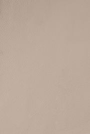 Nahaufnahme einer beigen Lederstruktur, von oben betrachtet.