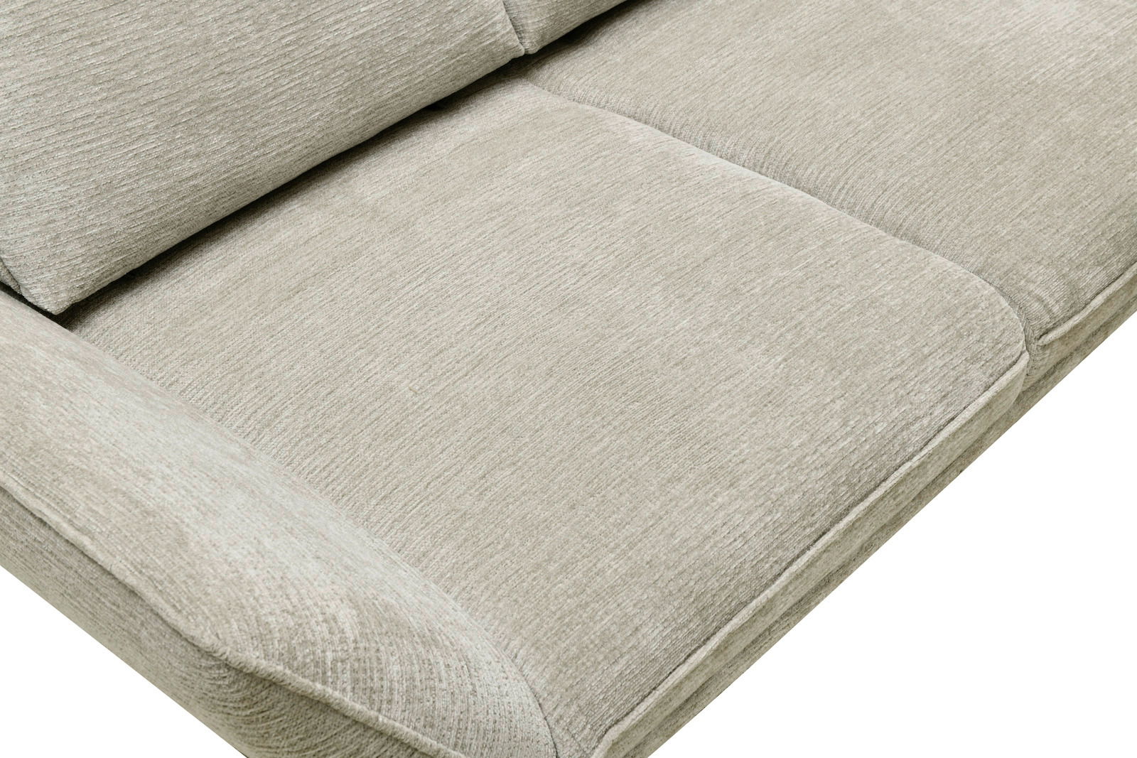 Nahaufnahme eines beigen Longchairs mit weicher Polsterung, seitliche Perspektive.