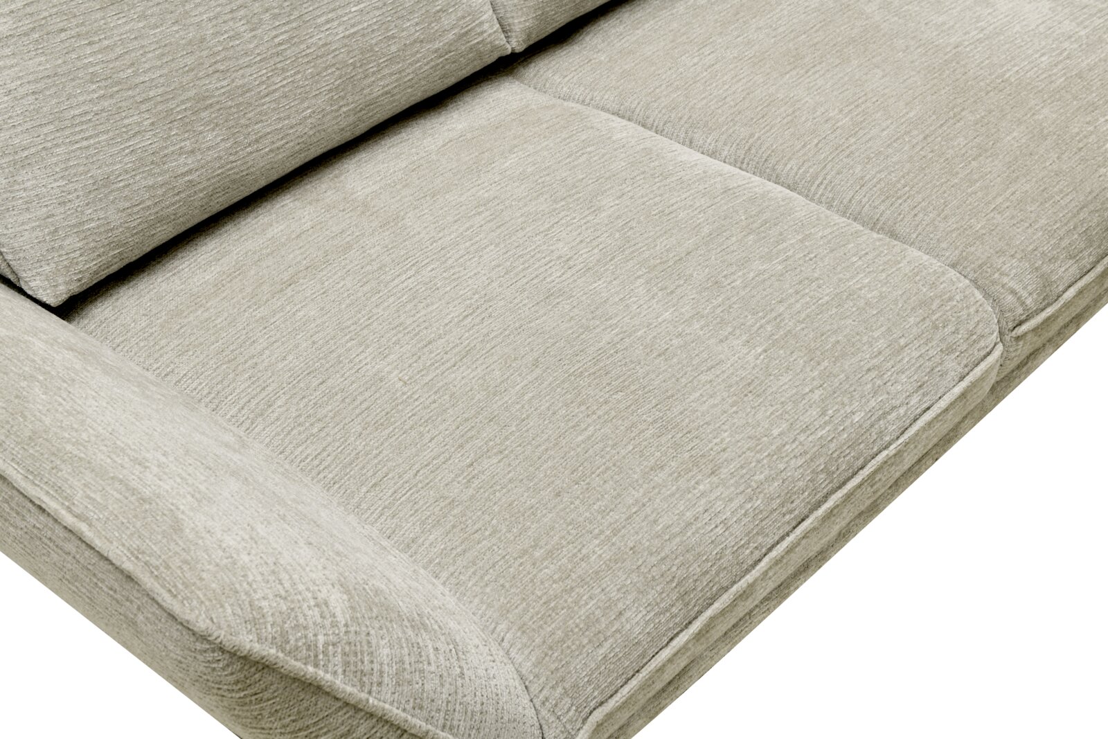 Nahaufnahme eines beigen Longchairs mit weicher Polsterung, seitliche Perspektive.