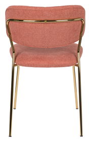 Rückansicht eines modernen Stuhls mit rosafarbenem Stoffbezug und goldenen Metallbeinen.