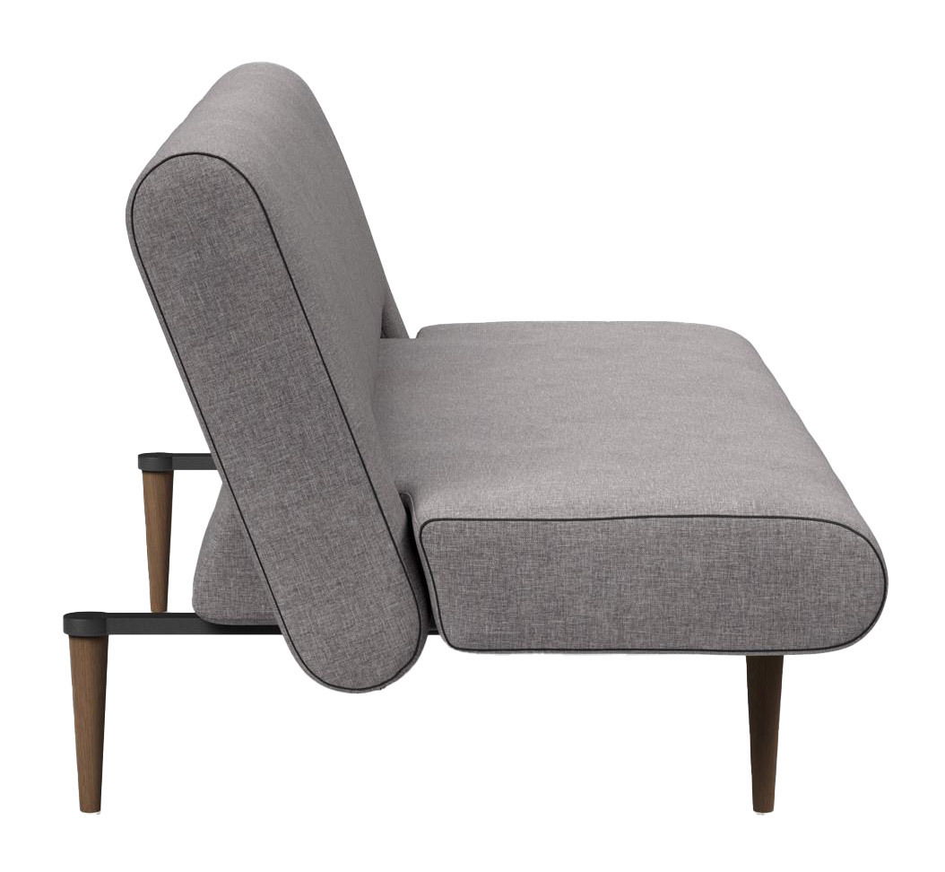 Seitenansicht eines grauen Funktionssofas mit Holzbeinen.