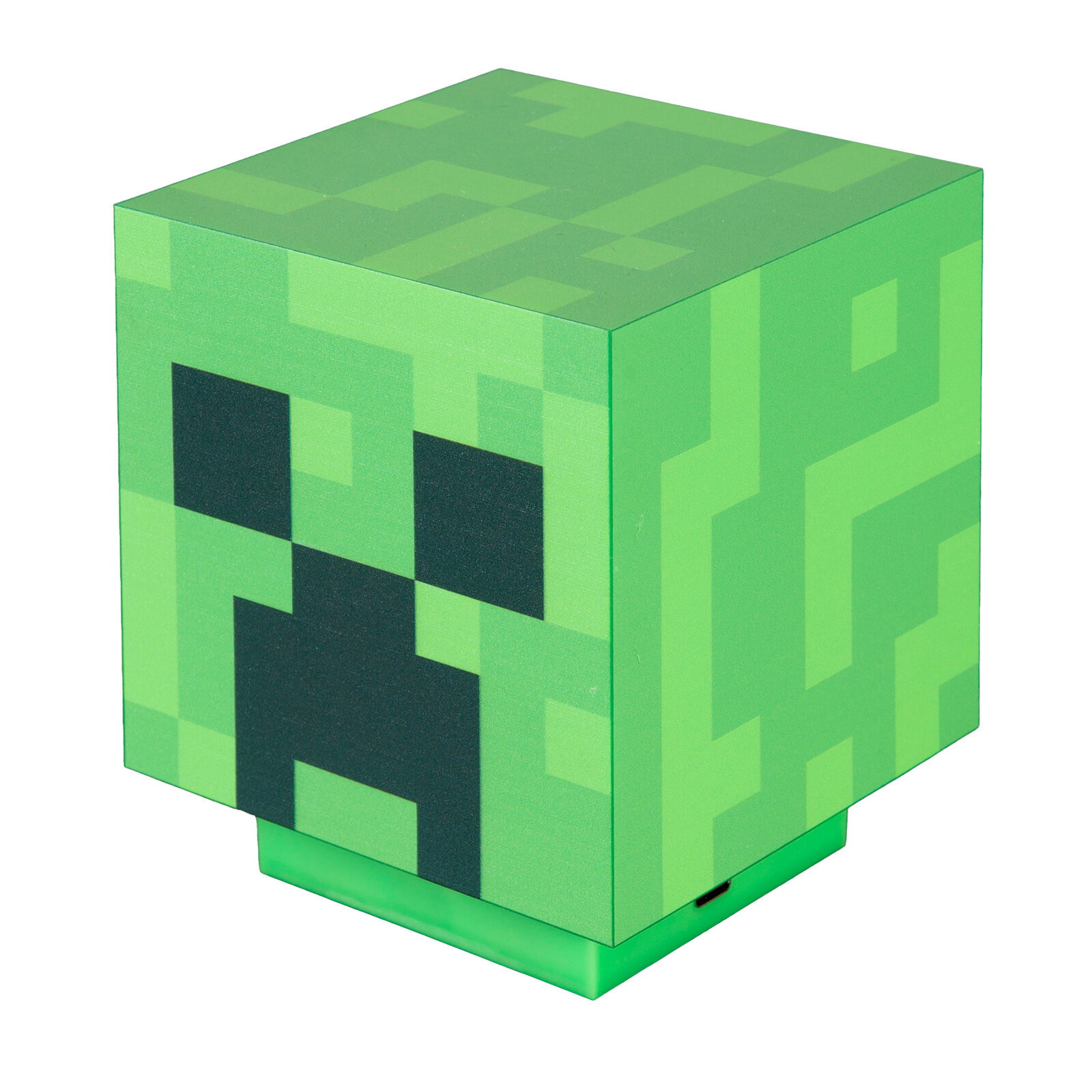 Grüne, würfelförmige Minecraft-Creeper-Lampe mit pixeligem Muster und Gesicht, schräg von vorne oben fotografiert.