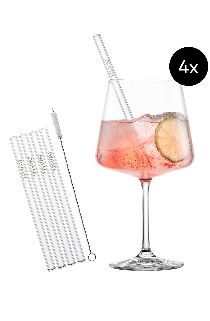 4er-Set transparente Glas-Trinkhalme mit Reinigungsbürste, daneben Weinglas mit rosafarbenem Getränk und Limettenscheibe; Produktansicht freigestellt vor weißem Hintergrund in Frontansicht
