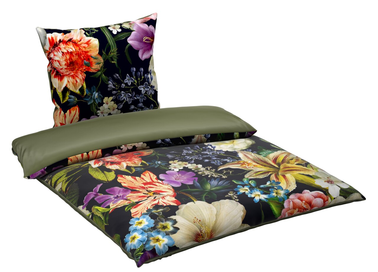Wendebettwäsche mit floralem Muster, Vorderseite mit bunten Blumen auf dunklem Hintergrund, Rückseite in einfarbigem Olivgrün, Perspektive von schräg oben.