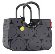 Graue Einkaufstasche mit schwarzen Smiley-Motiven und runden Griffen, seitliche Perspektive