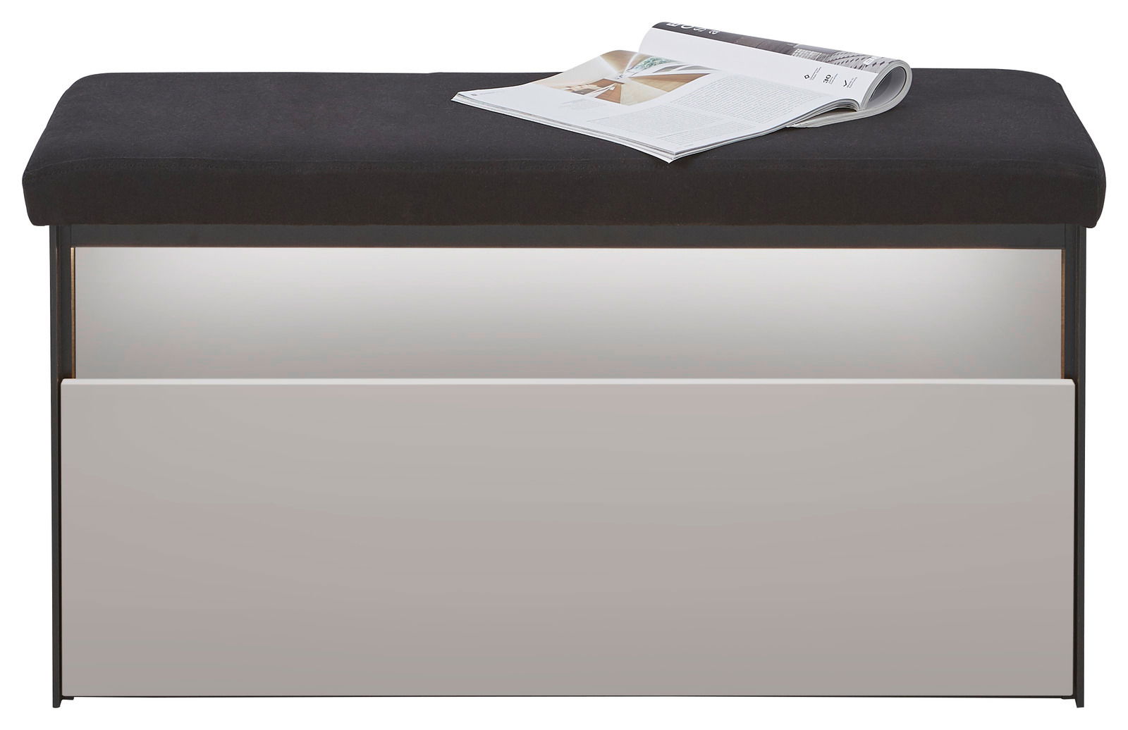Garderobenbank mit schwarzer Sitzfläche und weißer Frontansicht, darauf liegt eine geöffnete Zeitschrift.