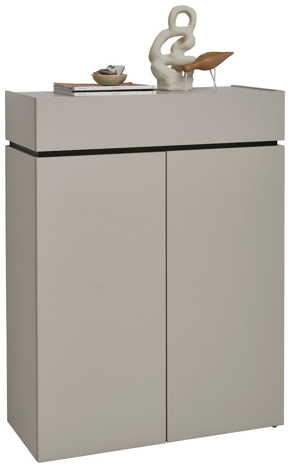 Voleo Schuhschrank UNIQUE Moderner Schuhschrank in minimalistischem Design mit zwei Türen, dekoriert mit Skulptur und Büchern, Frontalansicht.