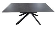 Moderner Esstisch mit dunkler Tischplatte und einzigartigem, geometrischem Untergestell, seitliche Perspektive.