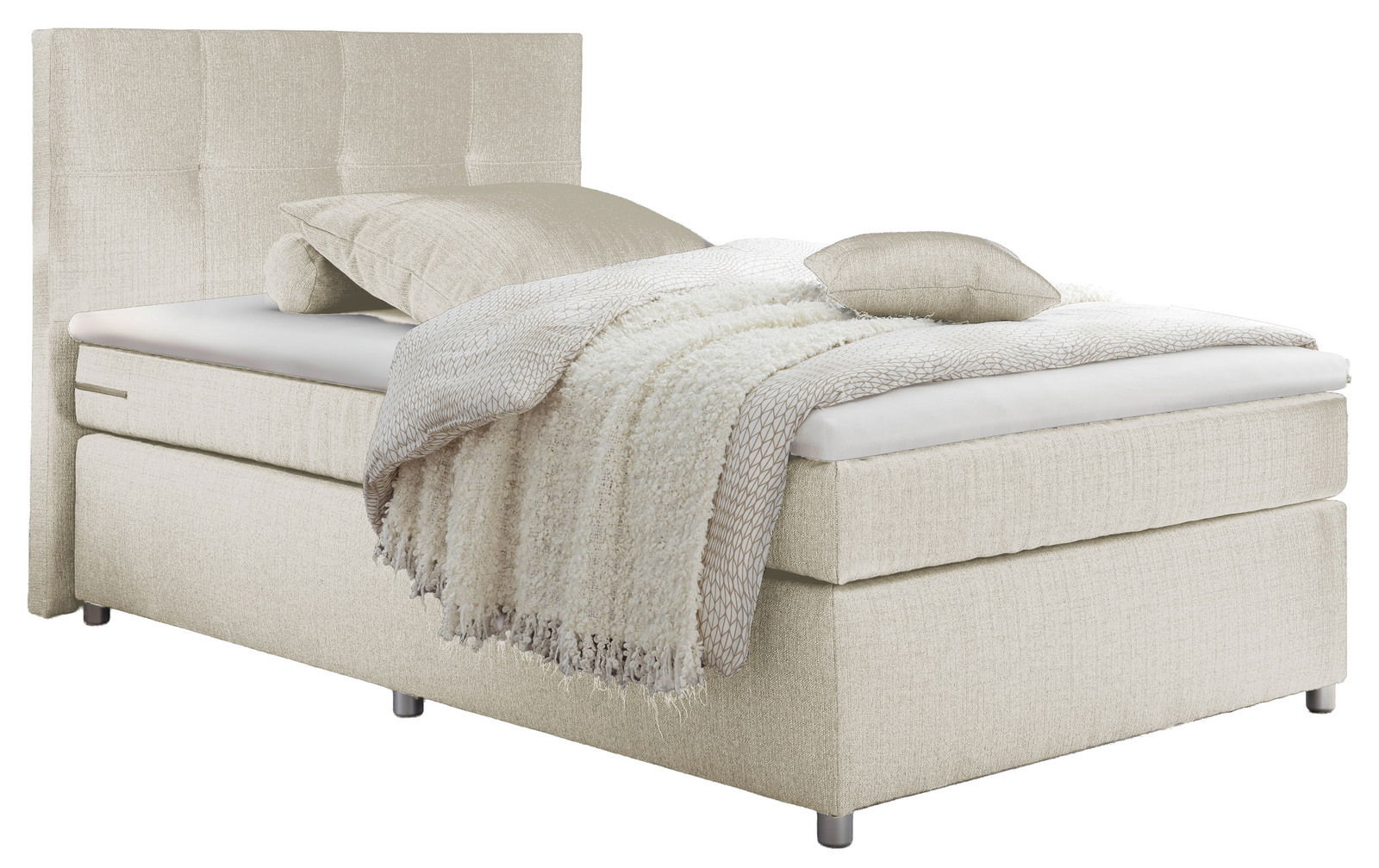 Beiges Boxspringbett mit Kopfteil, seitliche Perspektive, dekoriert mit Kissen und Decke.