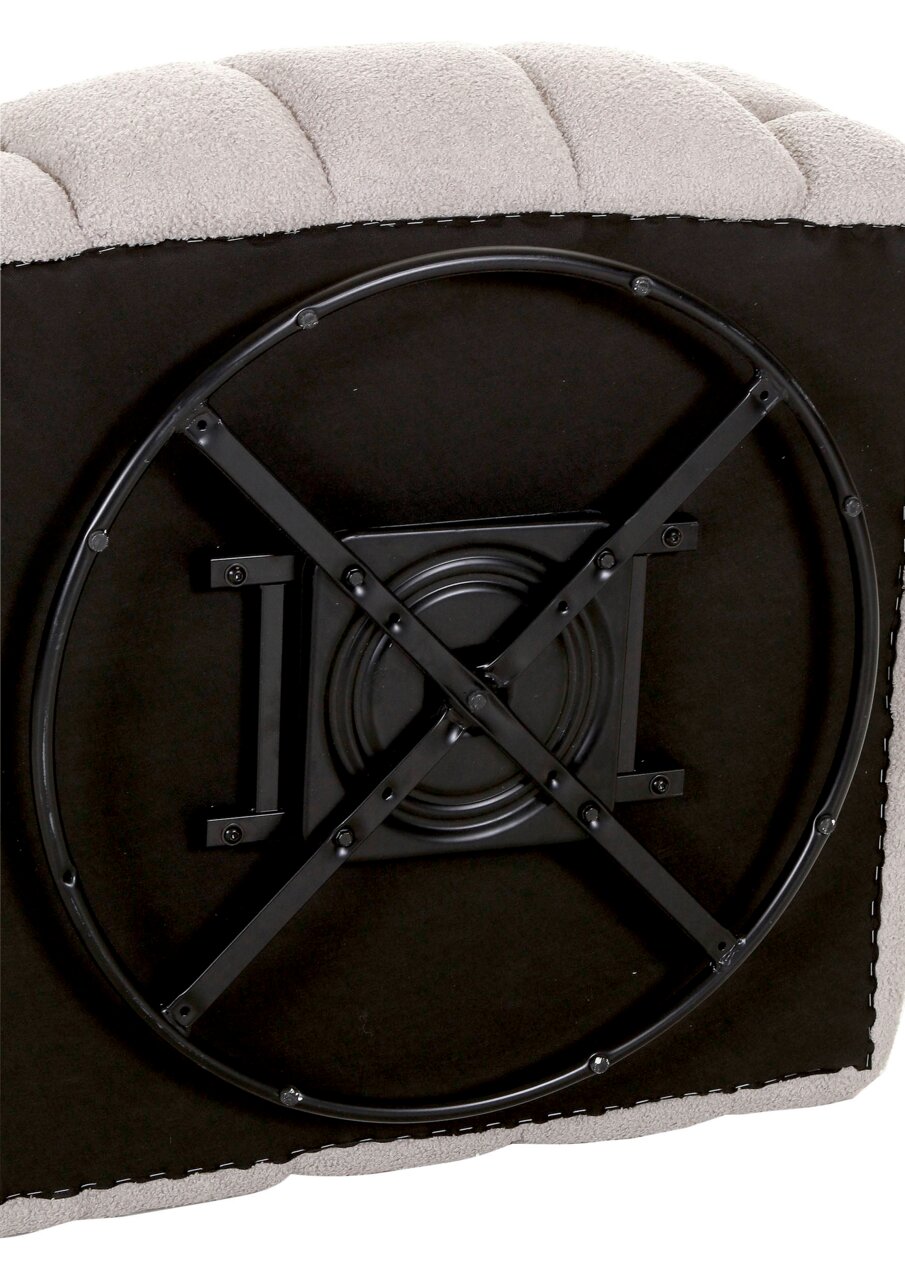 Unterseite eines Drehsessels mit schwarzem Metallgestell, Perspektive von unten