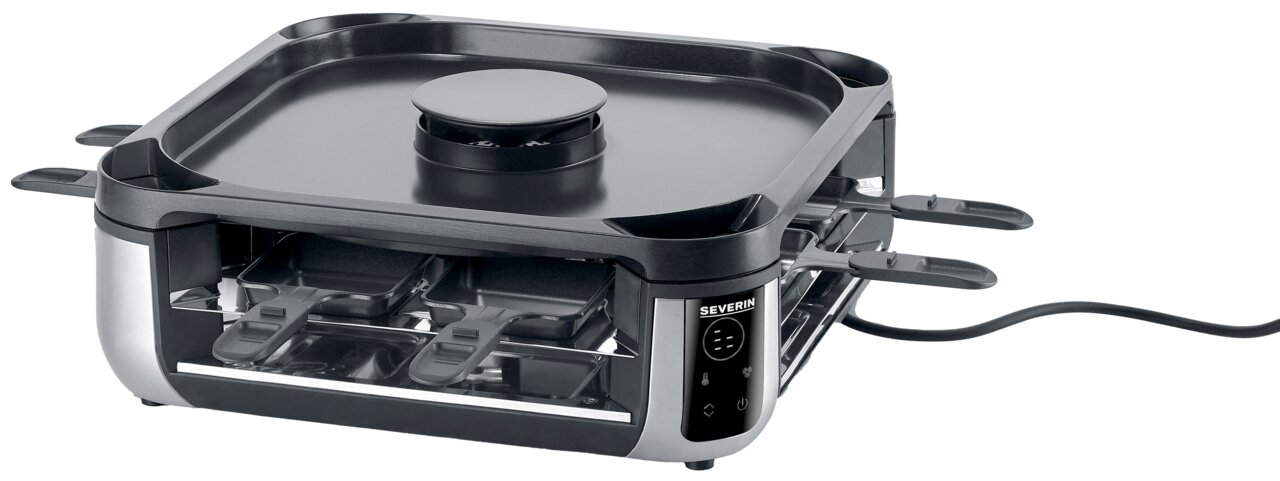 Smokeless Raclette-Grill von schräg vorne mit mehreren Pfännchen und glatter Grillplatte.