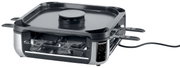 Smokeless Raclette-Grill von schräg vorne mit mehreren Pfännchen und glatter Grillplatte.
