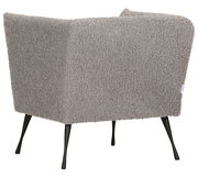 Rückansicht eines Sessels mit grauem, flauschigem Stoffbezug und schwarzen, schlanken Beinen.