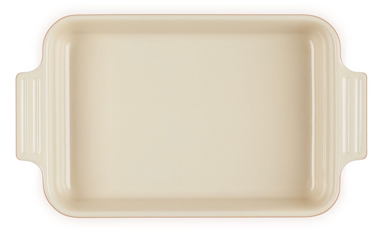 Aufsicht auf eine rechteckige, cremefarbene Auflaufform mit seitlichen Griffen.