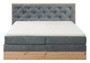 Boxspringbett mit grauem, gestepptem Kopfteil und Holzrahmen, Frontalansicht