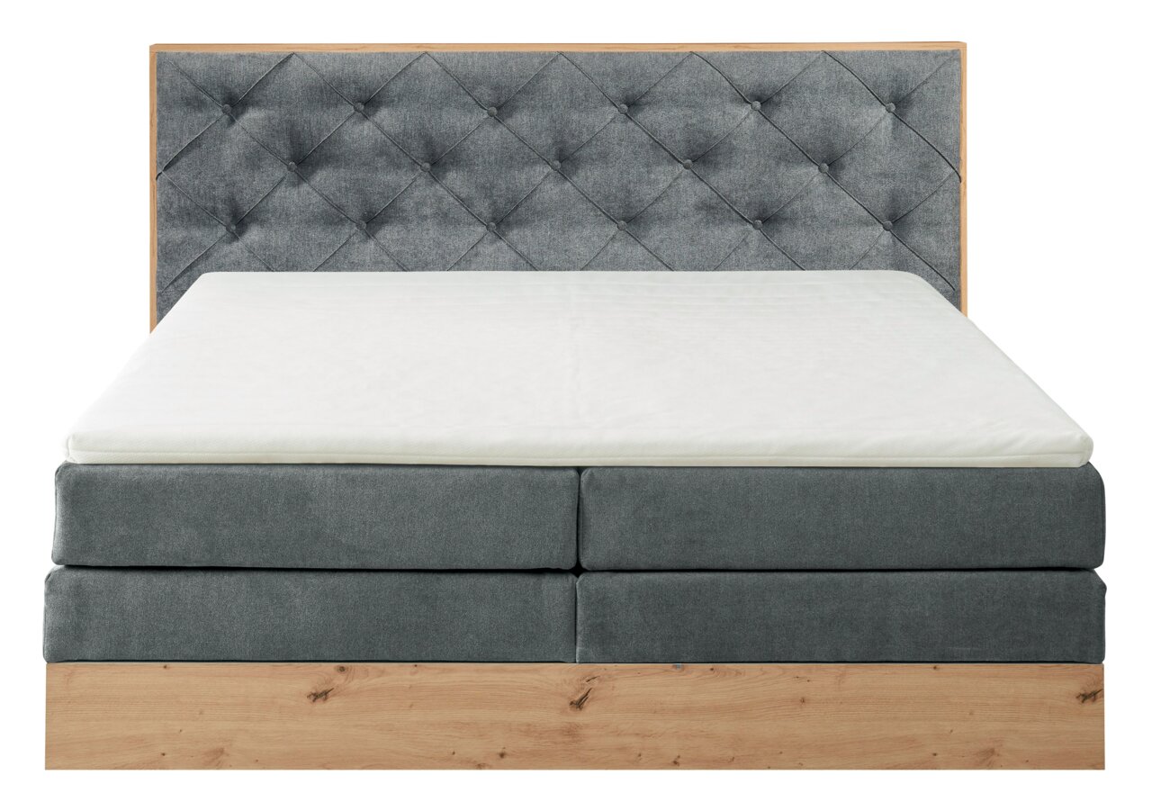 Boxspringbett mit grauem, gestepptem Kopfteil und Holzrahmen, Frontalansicht
