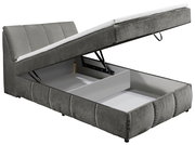 Graues Boxspringbett mit hochgeklappter Matratze und sichtbarem Stauraum, seitliche Perspektive