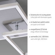 Moderne LED-Deckenleuchte mit zwei beleuchteten Quadratrahmen in Metall-Optik, ein Quadrat drehbar, warmweißes Licht (3000 K), Detailansicht aus schräger Untersicht.