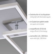 Moderne LED-Deckenleuchte mit zwei beleuchteten Quadratrahmen in Metall-Optik, ein Quadrat drehbar, warmweißes Licht (3000 K), Detailansicht aus schräger Untersicht.