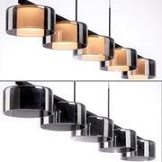 Moderne Pendelleuchte RIKA mit fünf zylindrischen, rauchgrauen Glasschirmen, seitliche Perspektive