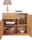 Holz-Sideboard mit geöffneter Schublade und Türen, dekoriert mit einer Lampe und Büchern, aus der Frontalperspektive.