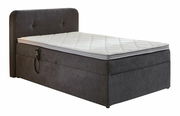 Boxbett mit Motor in seitlicher Perspektive, dunkelgrau mit weißer Matratze und Kopfteil.