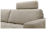 Beige bank met hoofdsteun, zijaanzicht