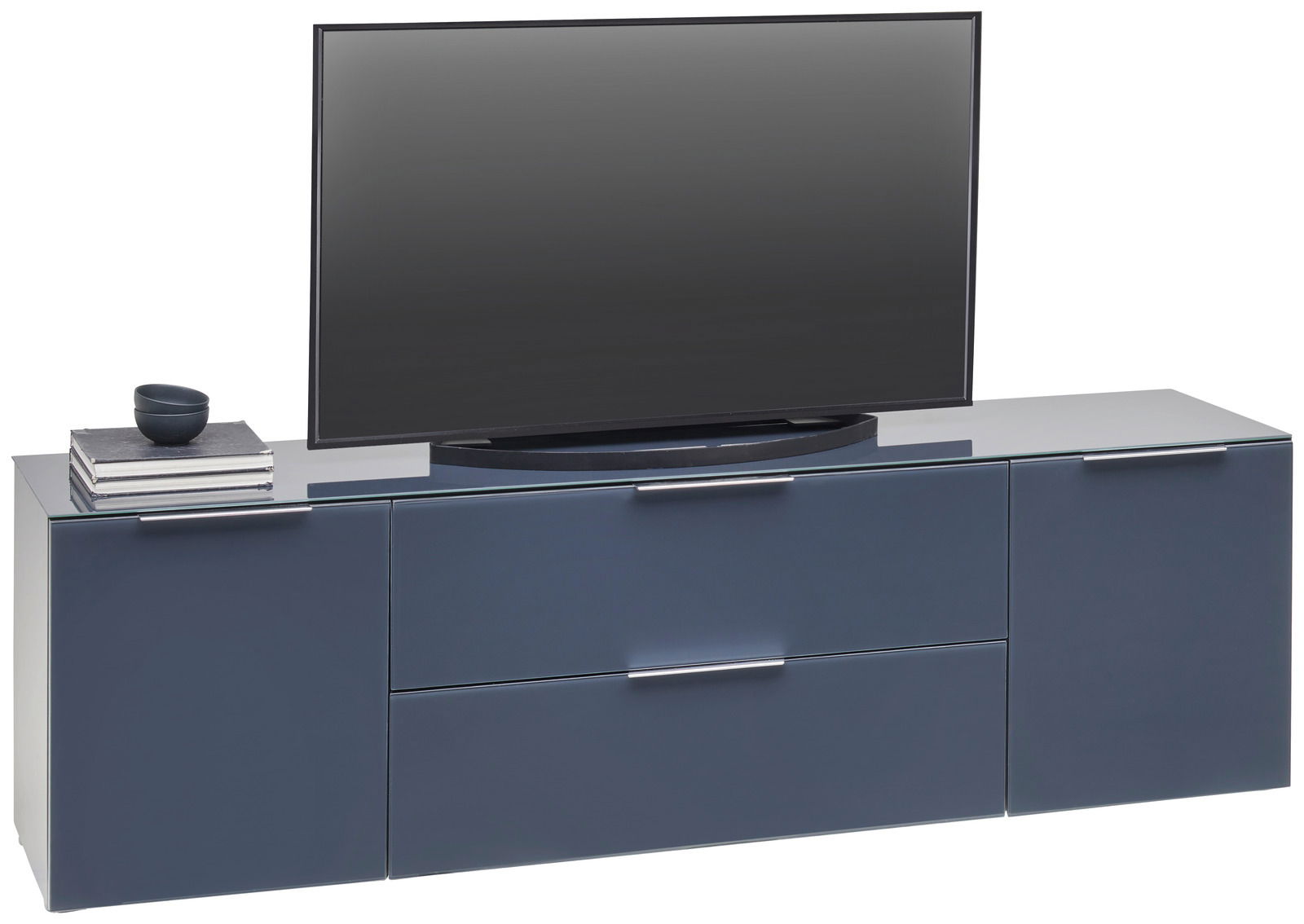 Modernes TV-Lowboard in dunklem Blau mit zwei Schubladen und zwei Türen, darauf ein Fernseher und Bücher, seitliche Perspektive