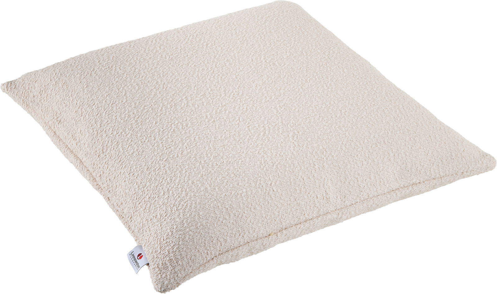 Beiges Outdoor-Kissen in Nahaufnahme, rechteckig, mit strukturierter Oberfläche und Etikett an der Seite, perspektivisch von oben fotografiert.