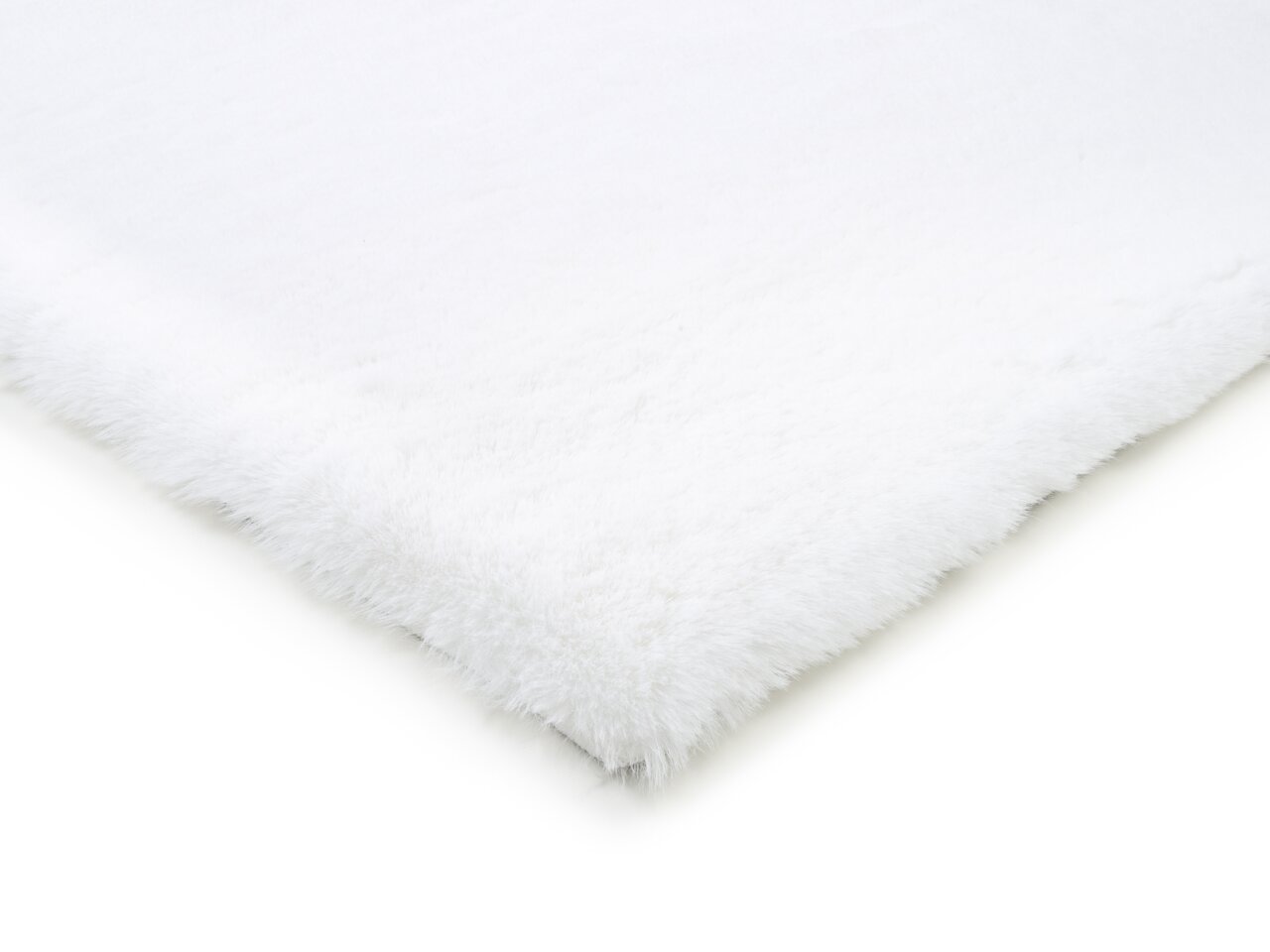 Nahaufnahme eines weißen Fellteppichs aus der Vogelperspektive