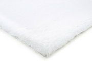 Nahaufnahme eines weißen Fellteppichs aus der Vogelperspektive